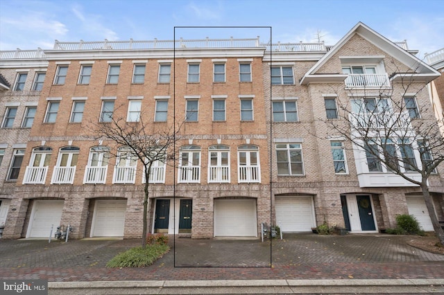 1252 Harbor Island Walk, Baltimore, MD 21230 - view of property featuring a garage and driveway
