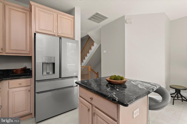 1252 Harbor Island Walk, Baltimore, MD 21230 - kitchen featuring stainless steel refrigerator with ice dispenser, light tile patterned floors, light brown cabinets, and a center island