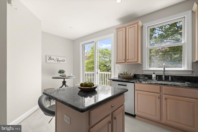 1252 Harbor Island Walk, Baltimore, MD 21230 - kitchen with dishwasher, a sink, light tile patterned floors, dark stone counters, and a center island