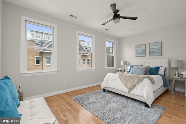 1252 Harbor Island Walk, Baltimore, MD 21230 - bedroom featuring wood finished floors, baseboards, and ceiling fan