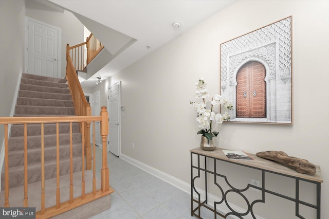 1252 Harbor Island Walk, Baltimore, MD 21230 - hall featuring baseboards, stairway, and tile patterned floors