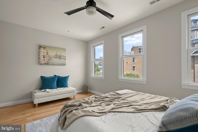 1252 Harbor Island Walk, Baltimore, MD 21230 - bedroom featuring light wood-style floors, baseboards, and a ceiling fan