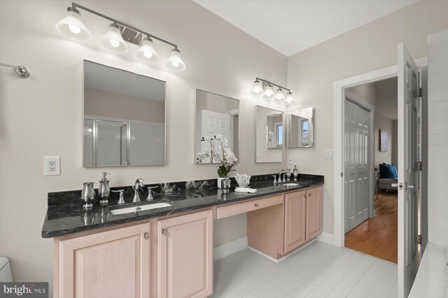 1252 Harbor Island Walk, Baltimore, MD 21230 - full bathroom featuring double vanity, tile patterned flooring, and baseboards