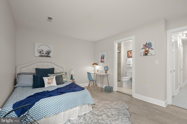 1252 Harbor Island Walk, Baltimore, MD 21230 - bedroom with baseboards and ensuite bathroom