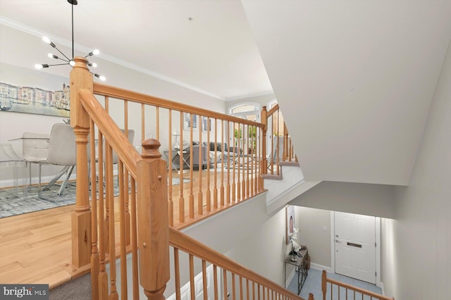 1252 Harbor Island Walk, Baltimore, MD 21230 - stairs with wood finished floors, baseboards, and crown molding