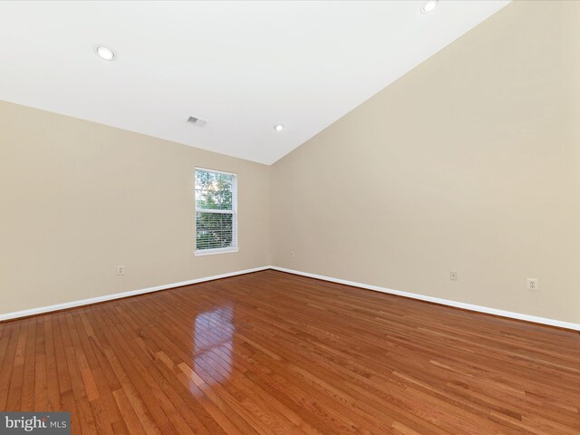 18312 Bailiwick Pl, Germantown, MD 20874 - empty room with hardwood / wood-style floors, baseboards, lofted ceiling, and recessed lighting