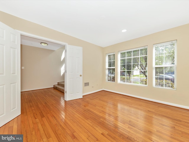 18312 Bailiwick Pl, Germantown, MD 20874 - spare room featuring light wood finished floors, baseboards, and stairway