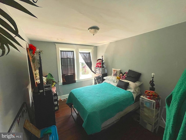 bedroom with wood finished floors