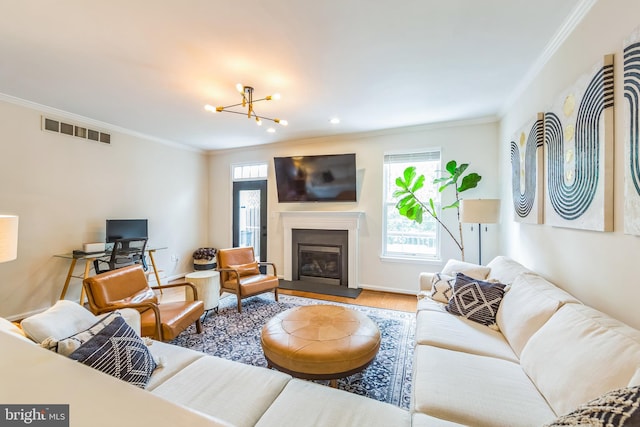 517 Bullock Unit 13, Conshohocken, PA 19428 - living room with plenty of natural light, crown molding, wood finished floors, a glass covered fireplace, and baseboards