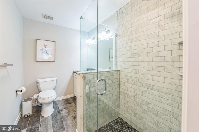 517 Bullock Unit 13, Conshohocken, PA 19428 - bathroom with toilet, a shower stall, vanity, wood finished floors, and baseboards