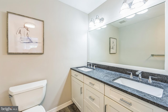 517 Bullock Unit 13, Conshohocken, PA 19428 - bathroom featuring toilet, double vanity, and baseboards