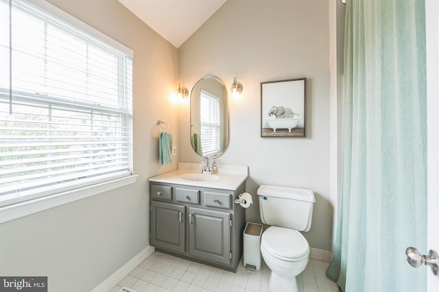 517 Bullock Unit 13, Conshohocken, PA 19428 - bathroom featuring lofted ceiling, vanity, toilet, baseboards, and tile patterned flooring