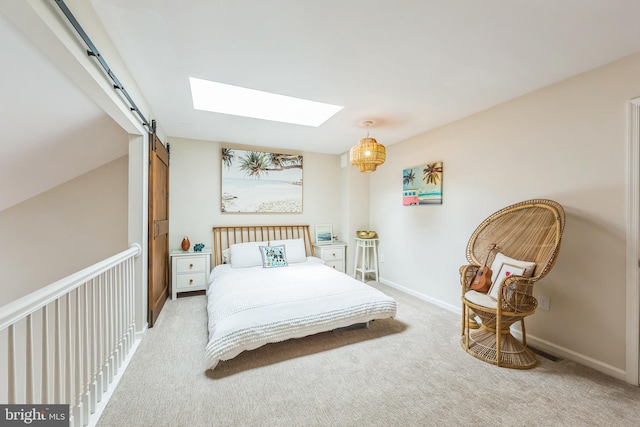 517 Bullock Unit 13, Conshohocken, PA 19428 - carpeted bedroom with a barn door, a skylight, and baseboards