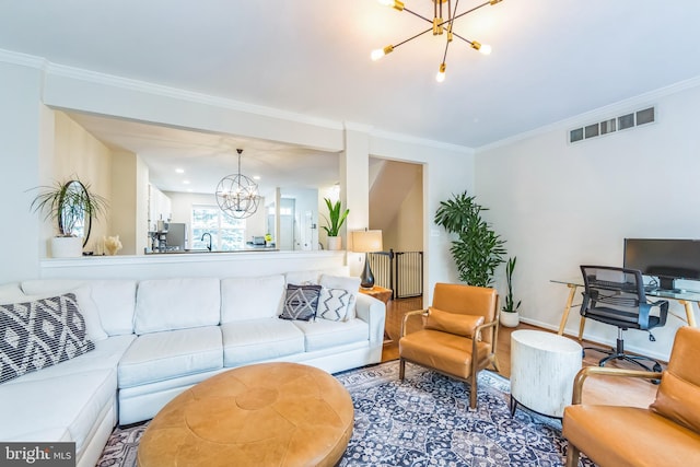 517 Bullock Unit 13, Conshohocken, PA 19428 - living room with a chandelier, wood finished floors, ornamental molding, and baseboards