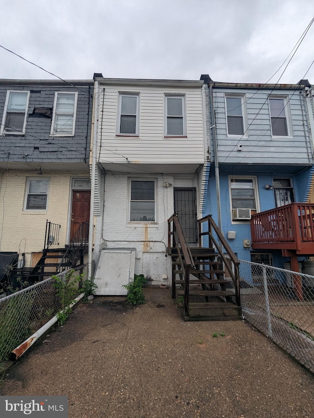 525 N Robinson St, Baltimore, MD 21205 - view of front of home featuring brick siding and cooling unit