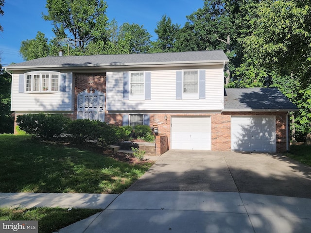 5504 Linwood Ct, Lanham, MD 20706 - raised ranch with brick siding, concrete driveway, and a front lawn