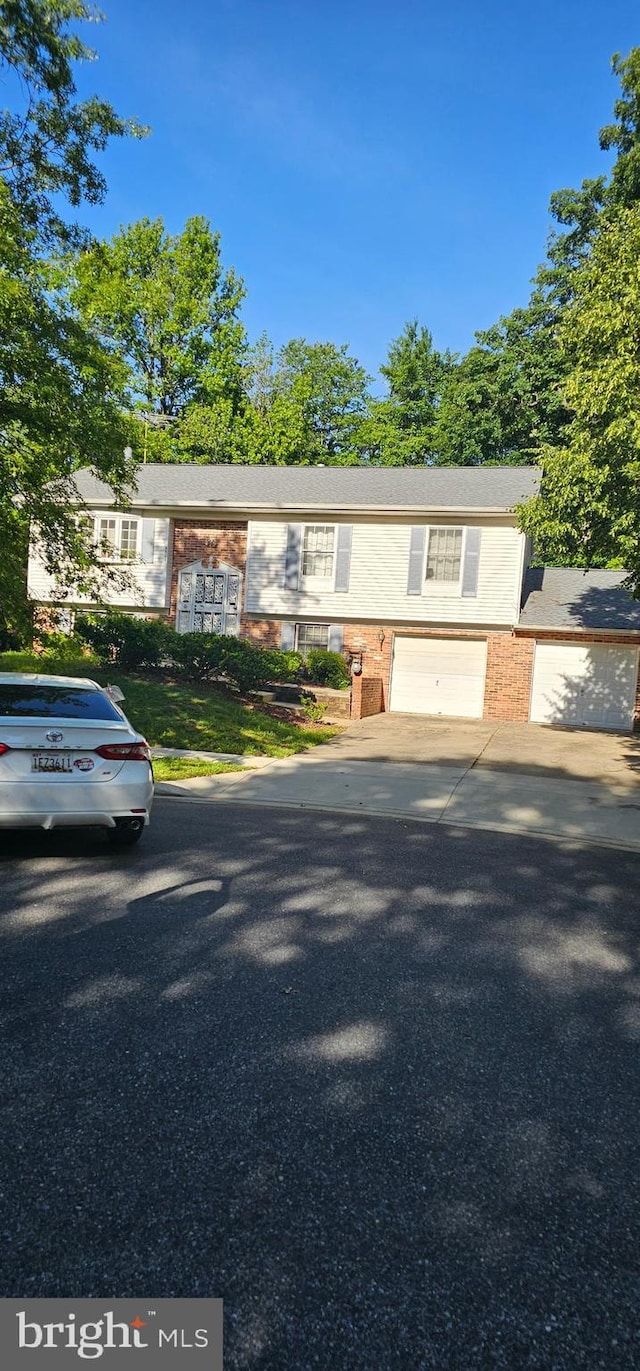 5504 Linwood Ct, Lanham, MD 20706 - view of front of house featuring an attached garage and driveway