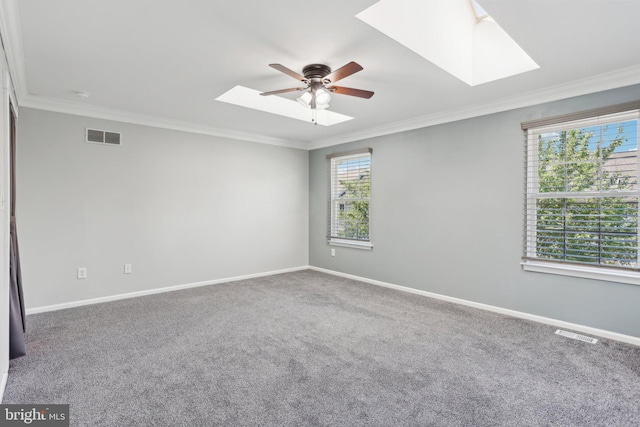 835 Sabina Cir, Bear, DE 19701 - carpeted empty room featuring a skylight, plenty of natural light, ceiling fan, and ornamental molding