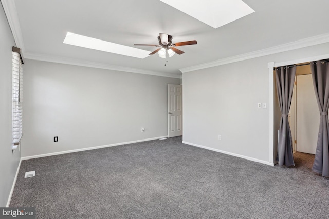835 Sabina Cir, Bear, DE 19701 - spare room with a skylight, ceiling fan, crown molding, carpet floors, and baseboards