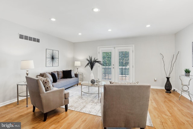 835 Sabina Cir, Bear, DE 19701 - living room featuring light wood-style floors, recessed lighting, baseboards, and french doors