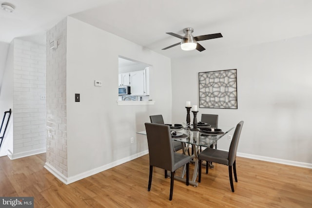 835 Sabina Cir, Bear, DE 19701 - dining area featuring light wood-type flooring, a ceiling fan, and baseboards