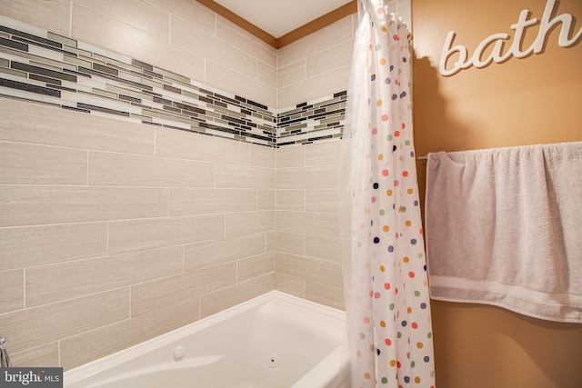 bathroom with shower / bath combo with shower curtain
