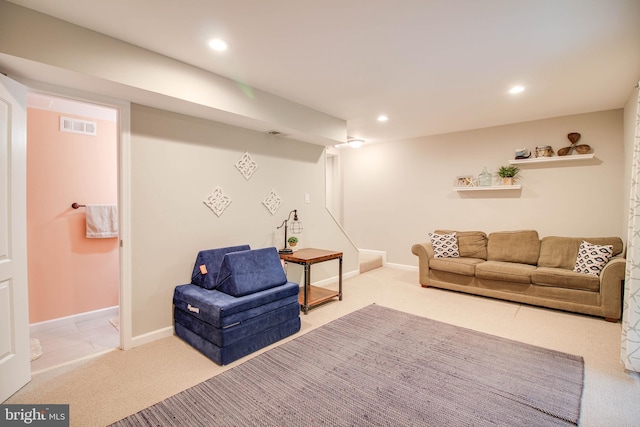 carpeted living room with recessed lighting and baseboards