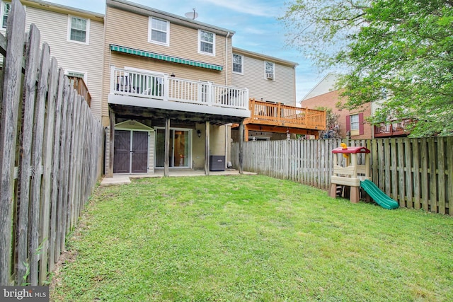 back of house featuring a wooden deck