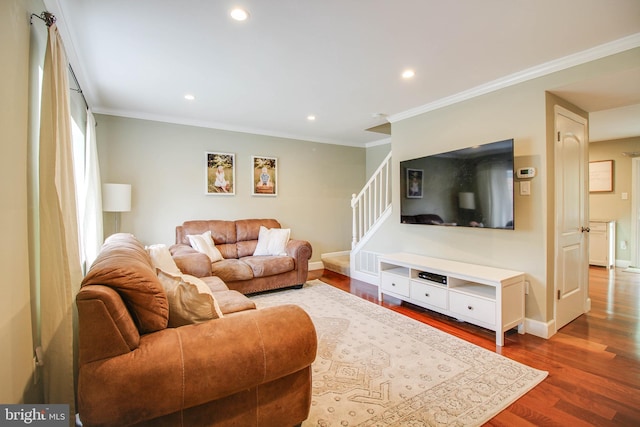 living area with dark wood finished floors, recessed lighting, crown molding, stairway, and baseboards