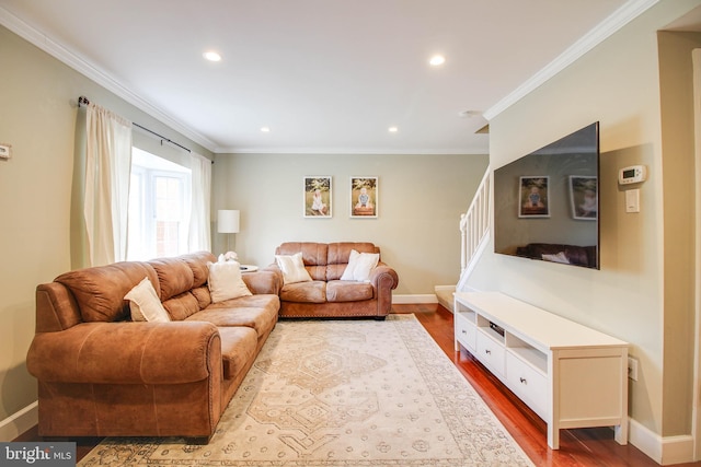 living area featuring ornamental molding, dark wood finished floors, baseboards, recessed lighting, and stairs