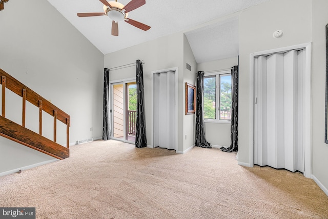 28 Chatham Ct, Dover, DE 19901 - unfurnished living room with carpet floors, a ceiling fan, high vaulted ceiling, and baseboards
