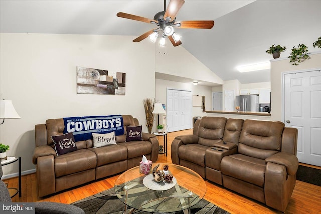 309 6th St, Colonial Beach, VA 22443 - living area with light wood-type flooring, a ceiling fan, and vaulted ceiling