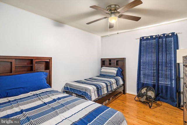 309 6th St, Colonial Beach, VA 22443 - bedroom with wood finished floors and a ceiling fan