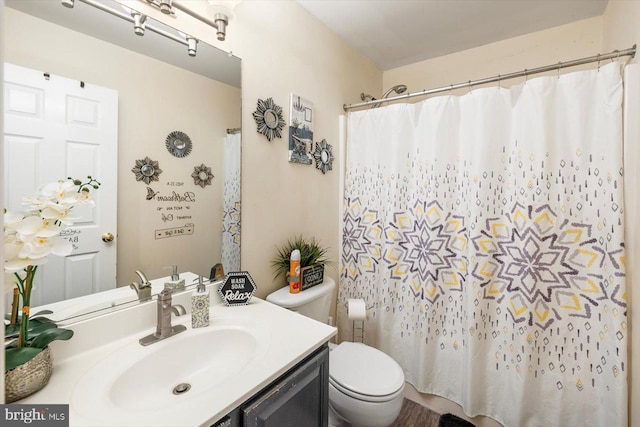 309 6th St, Colonial Beach, VA 22443 - bathroom with toilet, vanity, and a shower with curtain