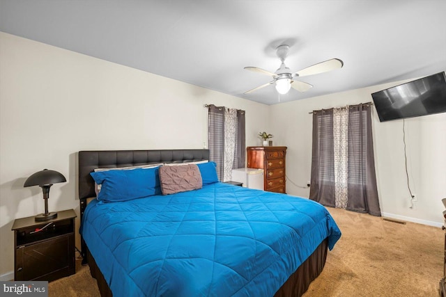 309 6th St, Colonial Beach, VA 22443 - bedroom with carpet flooring, baseboards, and a ceiling fan