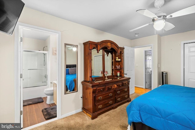309 6th St, Colonial Beach, VA 22443 - bedroom with baseboards, ensuite bath, a ceiling fan, and light wood-type flooring