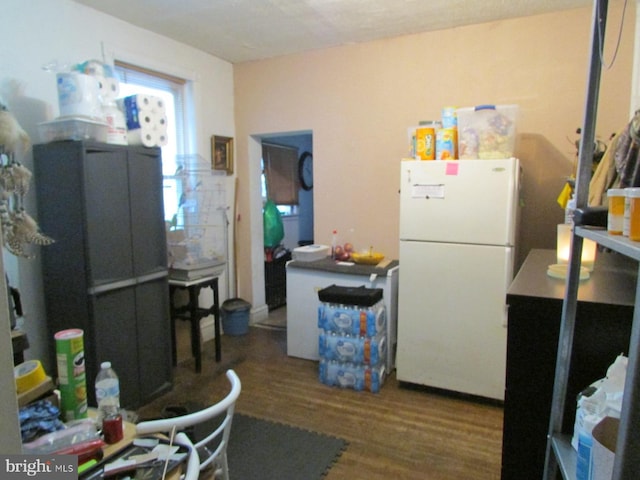 kitchen featuring freestanding refrigerator and wood finished floors