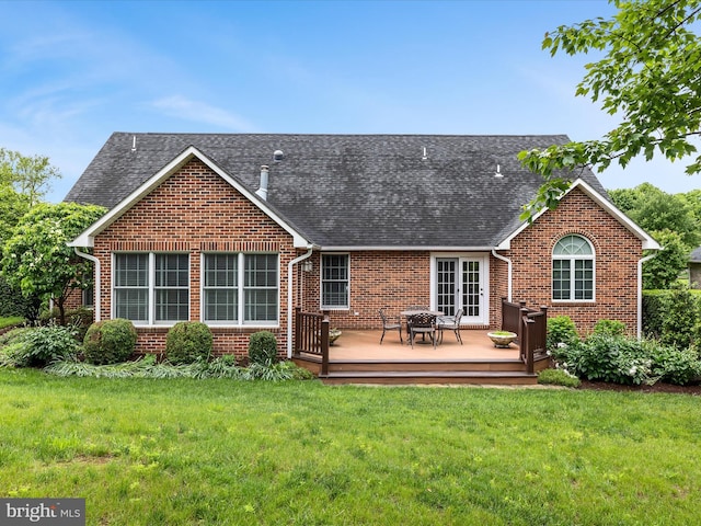 1412 Magruder Ct, Winchester, VA 22601 - back of property with brick siding, a deck, a yard, and roof with shingles