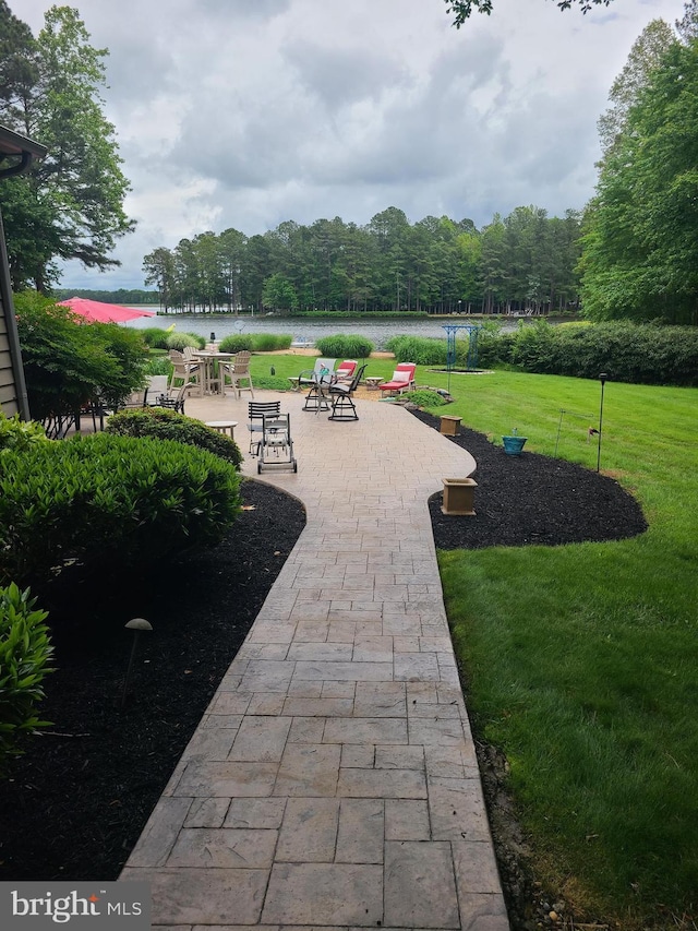 surrounding community featuring a yard and a patio