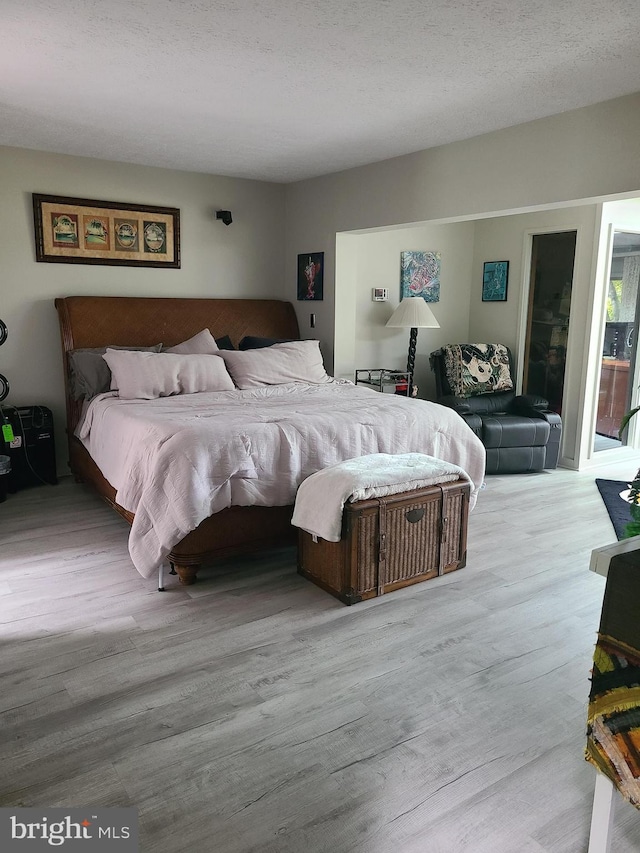 bedroom featuring wood finished floors