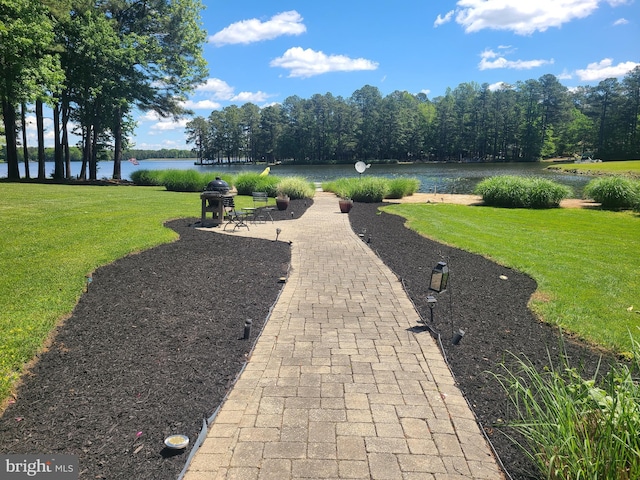 view of patio with a water view