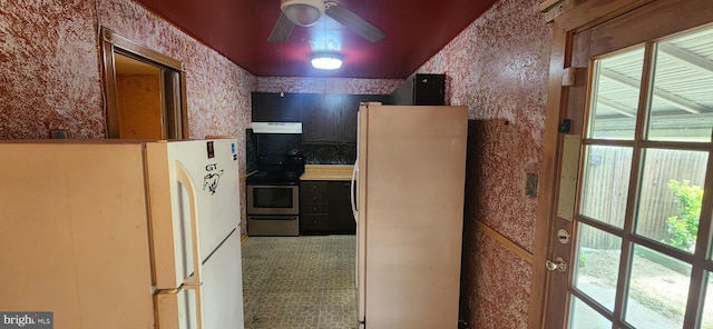 9422 Windpine Rd Unit 9422, Baltimore, MD 21220 - kitchen with freestanding refrigerator, stainless steel electric stove, under cabinet range hood, a ceiling fan, and wallpapered walls