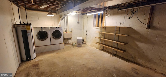 9422 Windpine Rd Unit 9422, Baltimore, MD 21220 - unfinished below grade area featuring washer and clothes dryer, water heater, and a sink