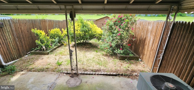 9422 Windpine Rd Unit 9422, Baltimore, MD 21220 - fenced yard with a vegetable garden, central air condition unit, a shed, and an outdoor structure