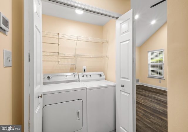 clothes washing area with washing machine and dryer, dark wood-style flooring, baseboards, and recessed lighting