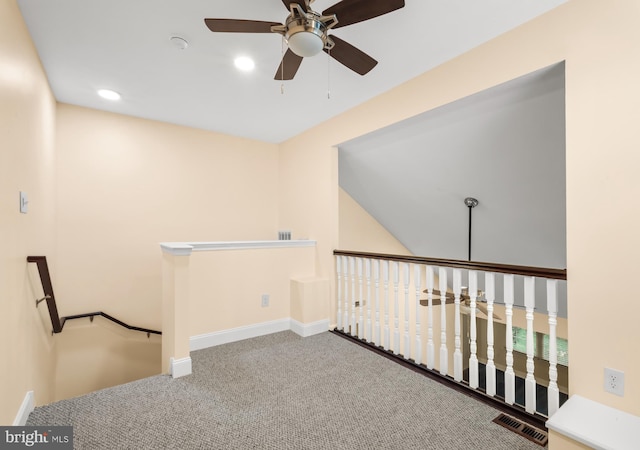 carpeted spare room featuring a ceiling fan, recessed lighting, and baseboards