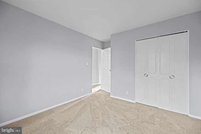 312 E Cornell Dr, Sterling, VA 20164 - unfurnished bedroom with carpet flooring, baseboards, and a closet