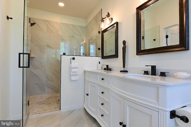bathroom featuring a shower stall, double vanity, recessed lighting, and marble look tiles