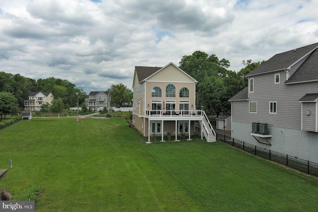 rear view of house featuring stairway, a wooden deck, and central AC unit