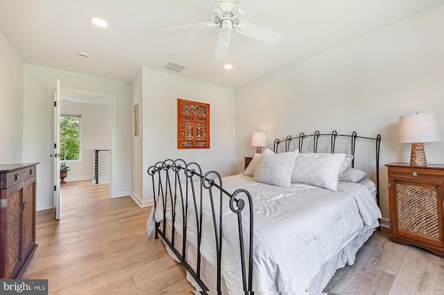 bedroom featuring light wood-style flooring, recessed lighting, ceiling fan, and baseboards